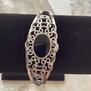 Black and silver bracelet, clasp closing